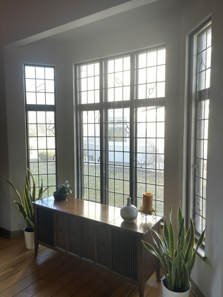 A living room in a historic building features ASI Climate Seal Preservation Series window inserts.